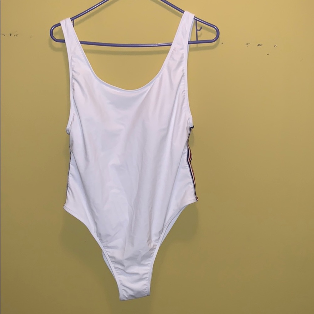White swimming suit with red, white & blue strips